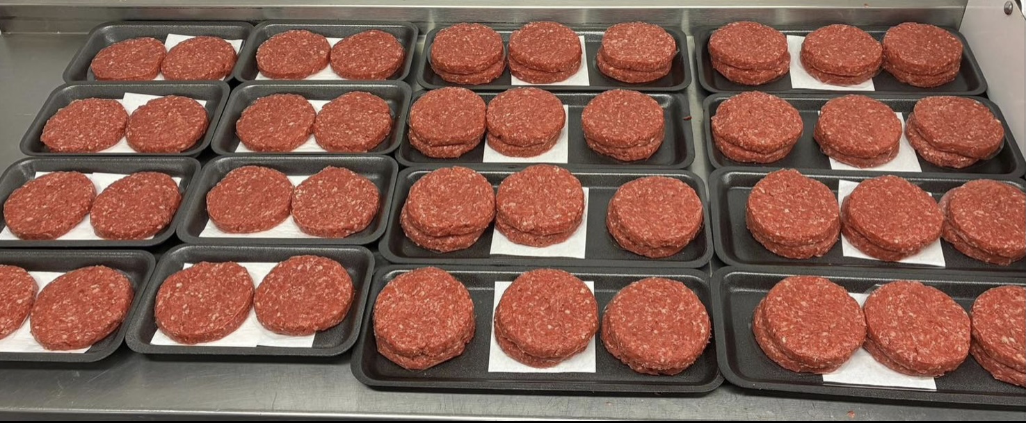 Tray of raw handmade burgers at Pantri Dysynni