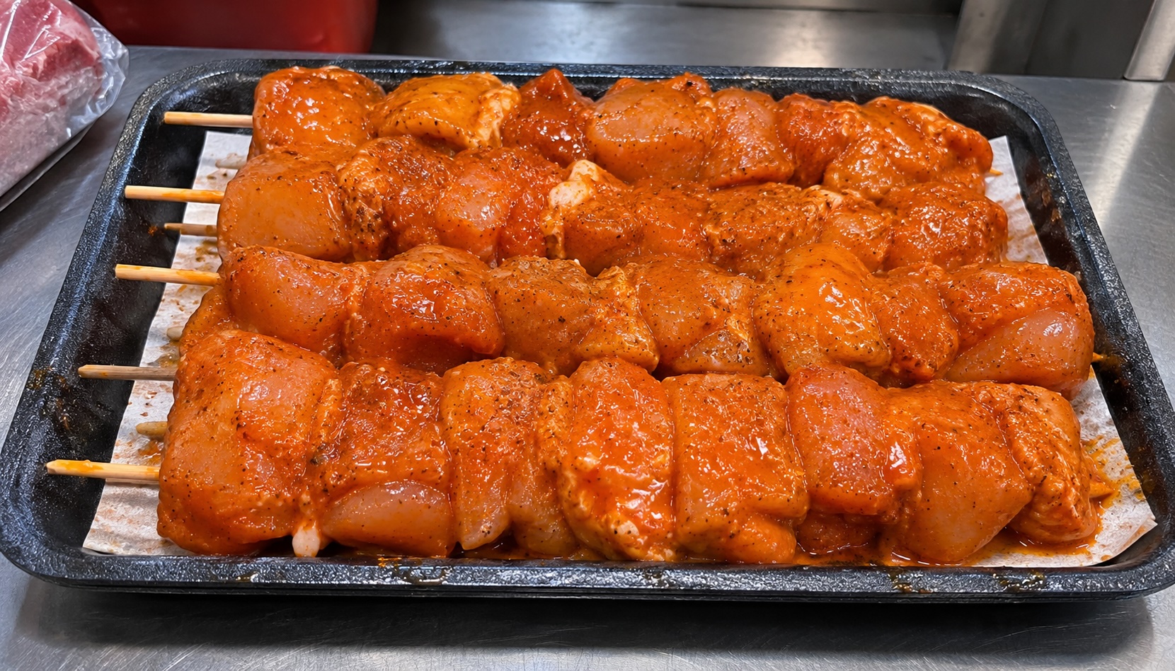 Marinated chicken legs in trays at Pantri Dysynni
